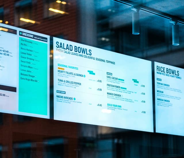 a digital menu board at a fast casual QSR restaurant